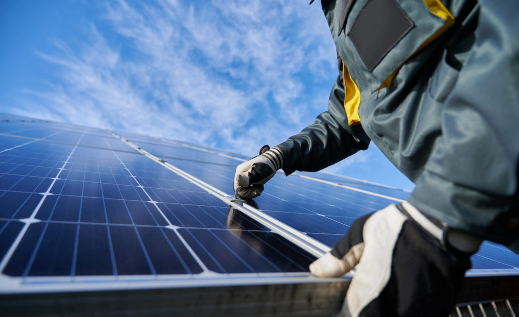 alamo solar man installing panels